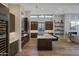 Spacious kitchen boasts a large island, modern appliances, and seamlessly integrates with living area at 5935 N Echo Canyon Ln, Phoenix, AZ 85018