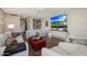 Elegant living room featuring modern furniture and a large television at 5935 N Echo Canyon Ln, Phoenix, AZ 85018
