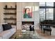 Cozy living room showcases a modern fireplace, unique artwork, and comfortable seating at 5935 N Echo Canyon Ln, Phoenix, AZ 85018