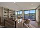 Upstairs living area with balcony access, mountain views, custom bookshelves and comfortable seating at 5935 N Echo Canyon Ln, Phoenix, AZ 85018