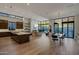 Spacious open-concept living space with gourmet kitchen and elegant dining area at 5935 N Echo Canyon Ln, Phoenix, AZ 85018