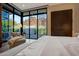 Stylish main bedroom with a lounge chair and panoramic outdoor views at 5935 N Echo Canyon Ln, Phoenix, AZ 85018