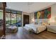 Elegant bedroom featuring a luxurious bed and scenic outdoor views at 5935 N Echo Canyon Ln, Phoenix, AZ 85018
