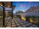 Outdoor patio featuring mountain views, modern furniture, and an outdoor waterfall at 5935 N Echo Canyon Ln, Phoenix, AZ 85018