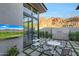 Outdoor patio featuring mountain views, modern furniture, and an outdoor television at 5935 N Echo Canyon Ln, Phoenix, AZ 85018