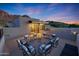 Relaxing rooftop deck with stylish seating arrangement against a backdrop of scenic mountain views at twilight at 5935 N Echo Canyon Ln, Phoenix, AZ 85018