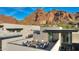 Rooftop patio with lounge seating featuring views of mountains and surrounding neighborhood at 5935 N Echo Canyon Ln, Phoenix, AZ 85018