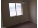 This bedroom features neutral walls, carpet, a window, and a ceiling fan at 706 N 96Th St, Mesa, AZ 85207