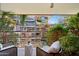 Balcony with seating and lush landscaping, offering a serene outdoor space at 7131 E Rancho Vista Dr # 4003, Scottsdale, AZ 85251