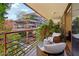 Balcony with comfortable seating and a serene view of surrounding greenery at 7131 E Rancho Vista Dr # 4003, Scottsdale, AZ 85251