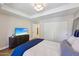 Bright bedroom featuring a large bed, TV, and closet for ample storage at 7131 E Rancho Vista Dr # 4003, Scottsdale, AZ 85251