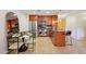 Modern kitchen with stainless steel appliances, granite counters, and adjacent dining area at 7131 E Rancho Vista Dr # 4003, Scottsdale, AZ 85251