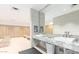Clean locker room with granite counters, modern sinks, and ample wooden storage at 7131 E Rancho Vista Dr # 4003, Scottsdale, AZ 85251