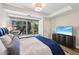 Bright bedroom with a large window and plenty of natural light, offering a peaceful atmosphere at 7131 E Rancho Vista Dr # 4003, Scottsdale, AZ 85251