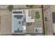 Aerial view of house with solar panels, modern backyard including mini golf, patio and fire pit at 829 W Mitchell Dr, Phoenix, AZ 85013