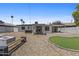 Backyard with mini-golf, a fire pit, gravel and a patio at 829 W Mitchell Dr, Phoenix, AZ 85013