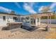 Backyard shows hot tub, decorative rock, patio area, and a covered outdoor space at 829 W Mitchell Dr, Phoenix, AZ 85013