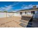 Backyard features a hot tub, hammock, and stone path amidst decorative rock and a bright blue sky at 829 W Mitchell Dr, Phoenix, AZ 85013