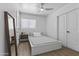 Cozy bedroom with a comfortable bed, ceiling fan, and natural light creating a peaceful and restful retreat at 829 W Mitchell Dr, Phoenix, AZ 85013