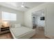 Bedroom with neutral tones, ceiling fan and a connected seating area with a television at 829 W Mitchell Dr, Phoenix, AZ 85013