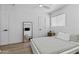 Inviting bedroom featuring a comfortable bed, a large mirror, soft lighting and minimalist decor, creating a relaxing atmosphere at 829 W Mitchell Dr, Phoenix, AZ 85013