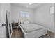 Comfortable bedroom featuring a bed, ceiling fan, ample natural light, and minimalist decor creating a peaceful retreat at 829 W Mitchell Dr, Phoenix, AZ 85013