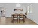 Cozy dining area with a wooden table, seating for four, and ample natural light creating a warm atmosphere at 829 W Mitchell Dr, Phoenix, AZ 85013