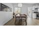 Bright dining room featuring a wooden table, stylish light fixture, and modern decor creating an inviting space at 829 W Mitchell Dr, Phoenix, AZ 85013