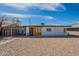 Charming single-story home with modern curb appeal, a carport, and low maintenance gravel landscaping at 829 W Mitchell Dr, Phoenix, AZ 85013