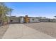 Cozy home boasting a charming carport, complemented by a low-maintenance gravel front yard, perfect for simple living at 829 W Mitchell Dr, Phoenix, AZ 85013