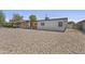 Inviting home featuring a carport, complemented by a low-maintenance gravel front yard, enhancing curb appeal at 829 W Mitchell Dr, Phoenix, AZ 85013