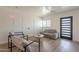 Bright living room featuring hardwood floors, a modern sofa, and sleek design at 829 W Mitchell Dr, Phoenix, AZ 85013