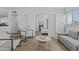 Open living space with modern decor, including hardwood floors and a cozy seating arrangement for relaxation at 829 W Mitchell Dr, Phoenix, AZ 85013