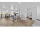 Well-lit living space featuring hardwood floors, modern furnishings, and an open layout connecting to the kitchen at 829 W Mitchell Dr, Phoenix, AZ 85013