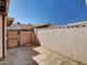 Exterior backyard view featuring hardscape, a block fence, and a metal gate at 8522 E Montebello Ave, Scottsdale, AZ 85250