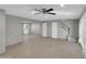 Finished basement with tile flooring, multiple entrances, and access to the upper floors via stairs at 8522 E Montebello Ave, Scottsdale, AZ 85250