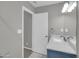 This is a bathroom featuring a vanity with marble countertops and a view of a carpeted room at 8522 E Montebello Ave, Scottsdale, AZ 85250