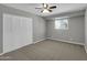 Bedroom with neutral carpeting, light gray walls and a window at 8522 E Montebello Ave, Scottsdale, AZ 85250