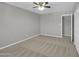 Bedroom with neutral walls and carpet, complemented by a ceiling fan at 8522 E Montebello Ave, Scottsdale, AZ 85250