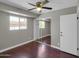 Cozy bedroom with a ceiling fan, closet with mirrored sliding doors, and a window at 8522 E Montebello Ave, Scottsdale, AZ 85250