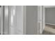 Hallway with a closet and entry to a bedroom with neutral walls and carpets at 8522 E Montebello Ave, Scottsdale, AZ 85250