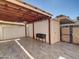 Outdoor patio with tile flooring and a wooden pergola-style covering at 8522 E Montebello Ave, Scottsdale, AZ 85250