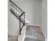 Carpeted stairs with a black metal railing lead to the upper level at 8522 E Montebello Ave, Scottsdale, AZ 85250