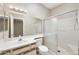 Bathroom with a shower featuring glass doors, a large mirror, and a vanity sink at 8614 N 67Th Dr, Peoria, AZ 85345