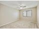 Bedroom featuring plush carpet, neutral colors, and a window at 8614 N 67Th Dr, Peoria, AZ 85345