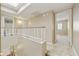 Upstairs hallway featuring a skylight and neutral paint tones at 8614 N 67Th Dr, Peoria, AZ 85345