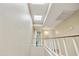 Upstairs hallway featuring a skylight and neutral paint tones at 8614 N 67Th Dr, Peoria, AZ 85345