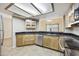 A functional kitchen featuring stainless steel appliances and a view into the dining area at 8614 N 67Th Dr, Peoria, AZ 85345