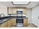 The kitchen features stainless steel appliances, light wood cabinets, and black granite countertops at 8614 N 67Th Dr, Peoria, AZ 85345