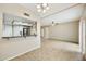 Open-concept living area with views of the kitchen, featuring tile flooring and ample natural light at 8614 N 67Th Dr, Peoria, AZ 85345